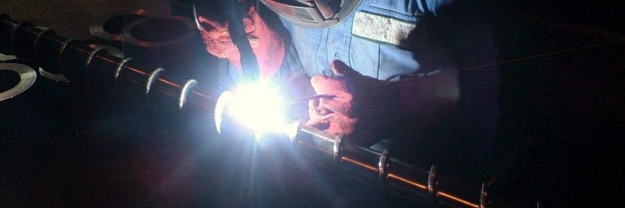 Hard-facing being welded onto a screw in the TWS workshop